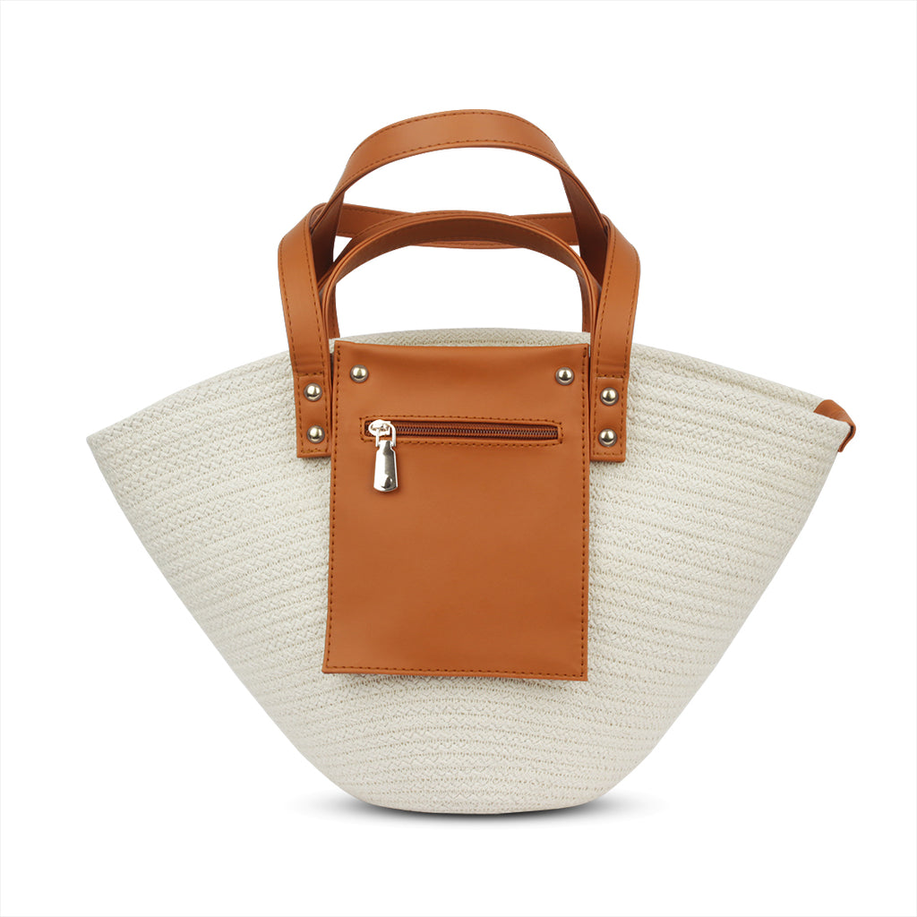 Beige straw handbag with brown leather patch and handle on a white background - tryon