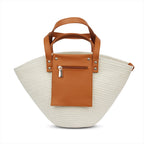 Beige straw handbag with brown leather patch and handle on a white background - tryon