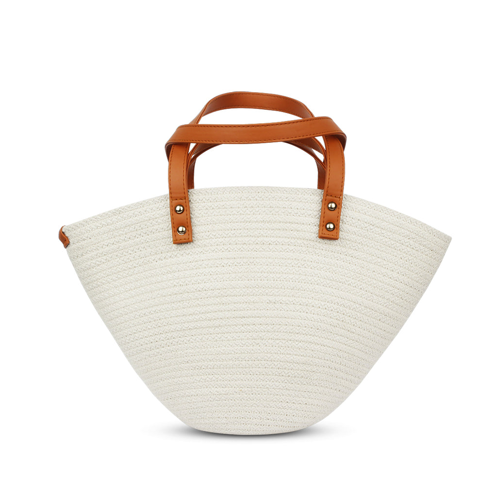White woven handbag with brown leather handles on a white background