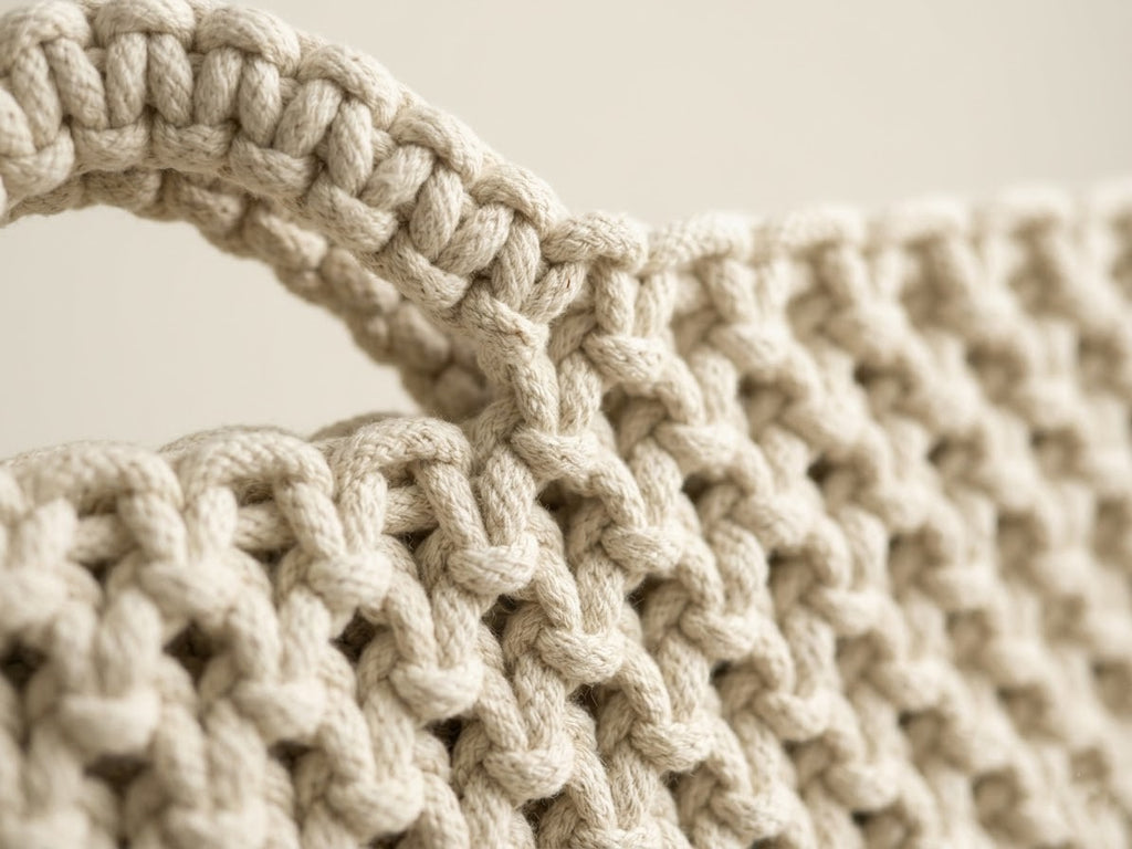ZAWJIEN Luna Sleeve - Handcrafted macrame laptop sleeve, editorial photo